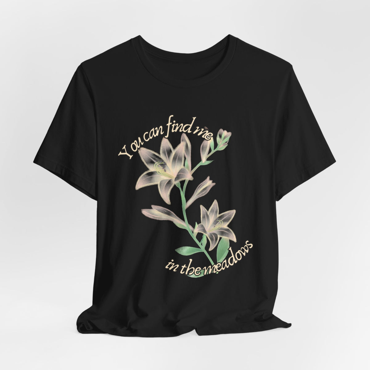 Floral Comfort Tee — "You can find me in the meadows..." Soft White Graphic T‑Shirt