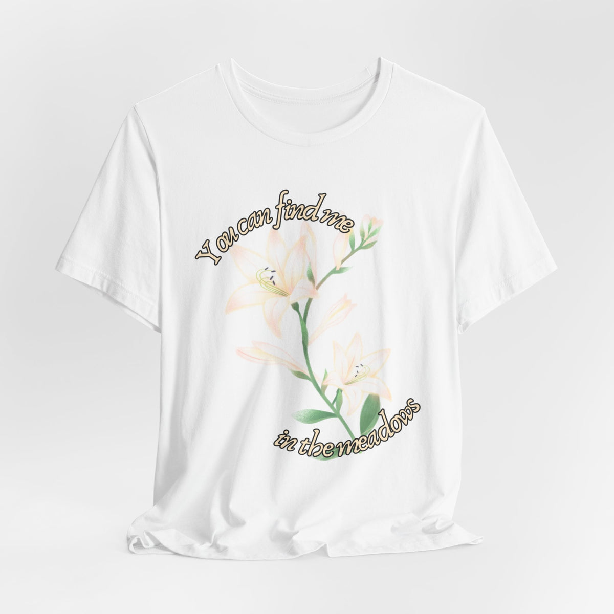 Floral Comfort Tee — "You can find me in the meadows..." Soft White Graphic T‑Shirt